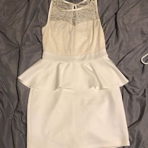 A mid dress layered with a wavy layer, a laced top